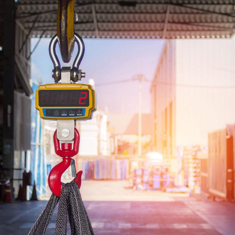 Technician set Industrial digital scales use weight check in factory and overhead crane